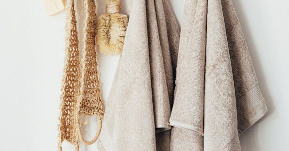 Sustainable Home Design - Set of body care tools with towels on hanger