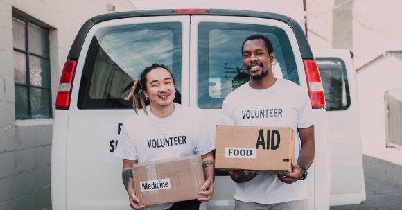 Food Labels - Volunteer Men Holding Medicine and Food Relief Supplies