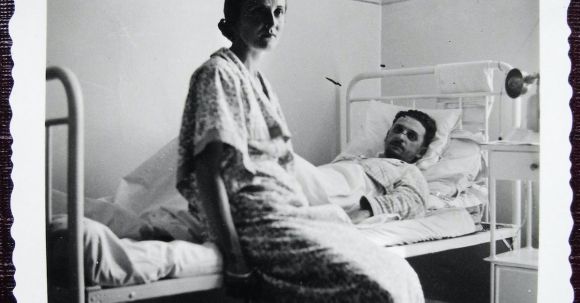 Disease Formation - Aged photography of man lying on bed in hospital bed with woman sitting nearby
