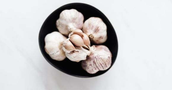 Flavorful Vegetarian - Bunch of fresh garlic in bowl