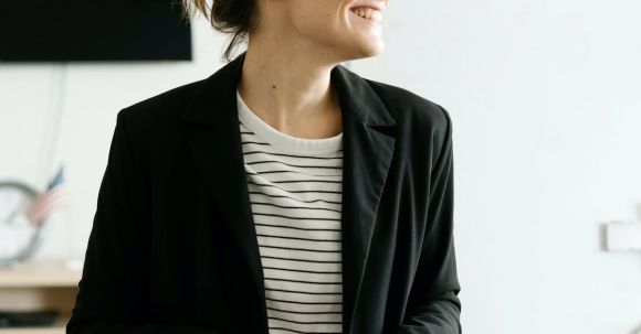 Formal Attire - Woman In Black Coat Smiling