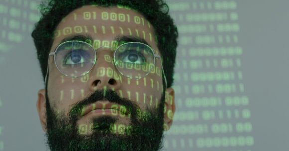 Secure Online. - Man With Binary Code Projected on His Face