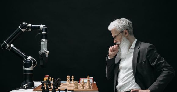 Game-changing Innovations - Elderly Man Thinking while Looking at a Chessboard