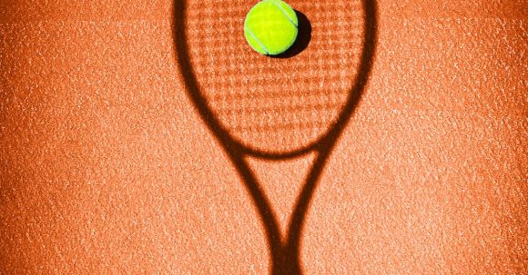Tennis Basics - Shadow of a Tennis Racket on a Tennis Court