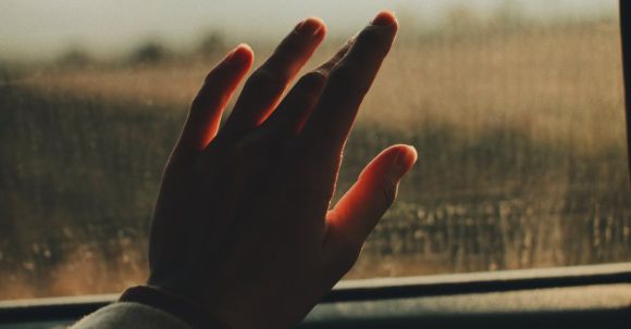 Forgiveness Journey - Hand on a Car Window