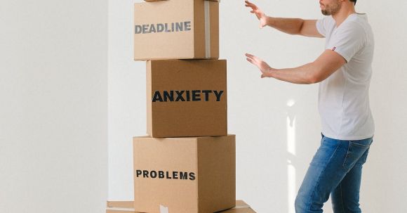Data-driven Decisions. - Man near carton boxes with many different words about stress