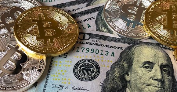 Blockchain Revolution. - Bitcoins and U.s Dollar Bills