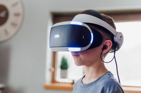 Virtual Reality - boy wearing black and white VR headset