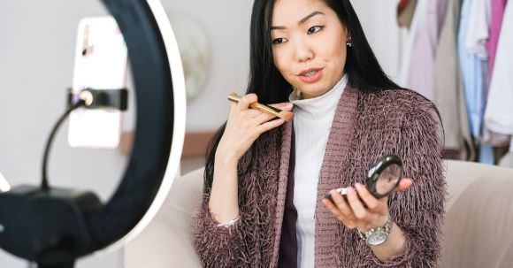 Fashion Tips - Vlogger Applying Makeup and Live Streaming with her Phone