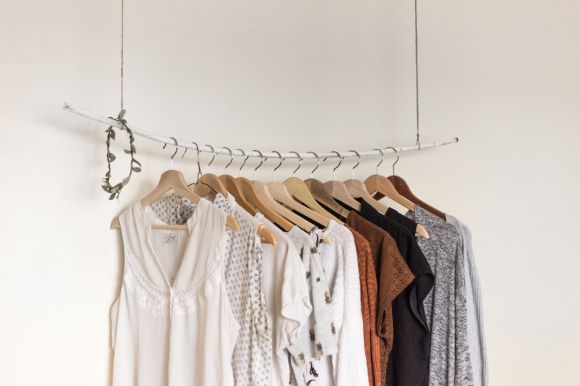 Fashion - assorted clothes in wooden hangers