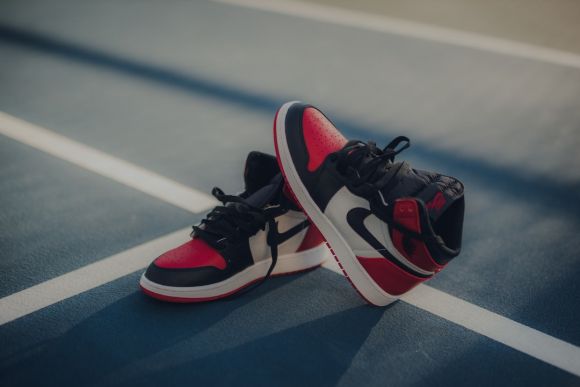 Sneakers - pair of black-white-and-red Air Jordan 1 shoes
